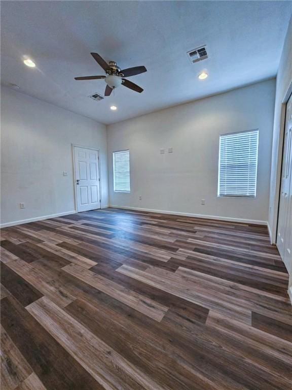 empty room featuring ceiling fan and dark hardwood / wood-style floors