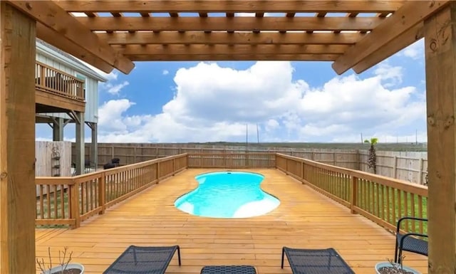 view of pool featuring a wooden deck and a pergola