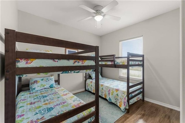 bedroom featuring ceiling fan and dark hardwood / wood-style floors