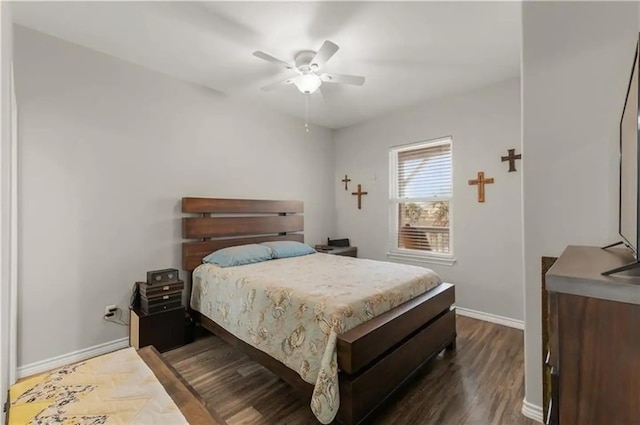 bedroom featuring dark wood-type flooring and ceiling fan