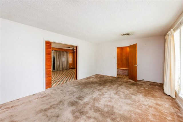 1325 S Whitney St, Aransas Pass, TX 78336 - spare room with visible vents, a healthy amount of sunlight, and carpet floors