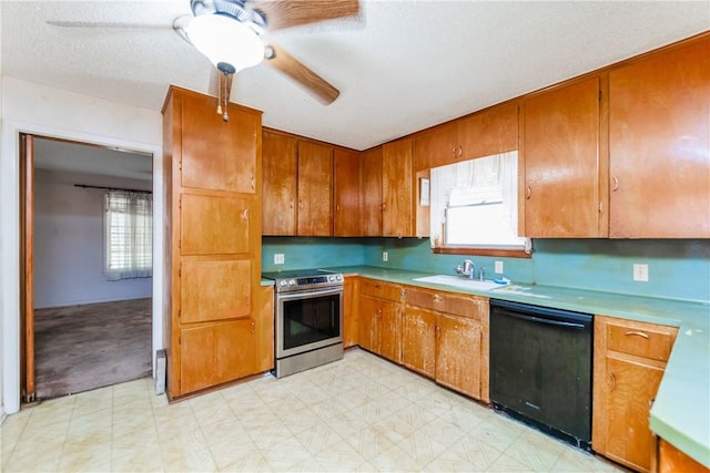 1325 S Whitney St, Aransas Pass, TX 78336 - kitchen with light floors, stainless steel electric range, black dishwasher, a ceiling fan, and brown cabinetry