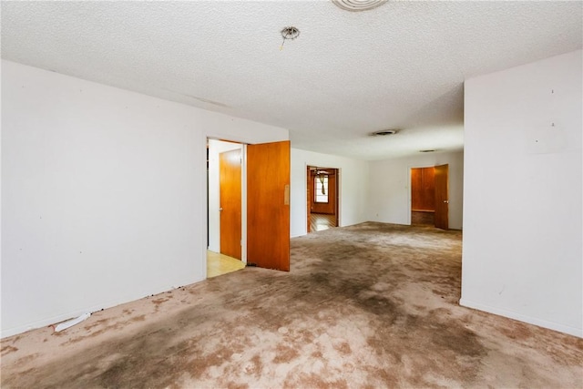 1325 S Whitney St, Aransas Pass, TX 78336 - carpeted spare room featuring a textured ceiling
