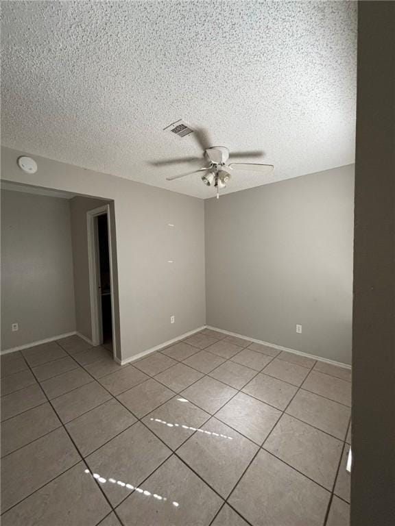 4401 River Valley Dr Unit 503, Corpus Christi, TX 78410 - spare room featuring ceiling fan, light tile patterned floors, a textured ceiling, and a smoke detector