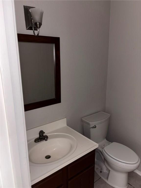 4401 River Valley Dr Unit 503, Corpus Christi, TX 78410 - half bathroom featuring vanity and tile patterned flooring