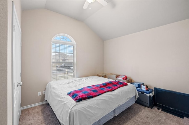 bedroom featuring ceiling fan, carpet, and lofted ceiling