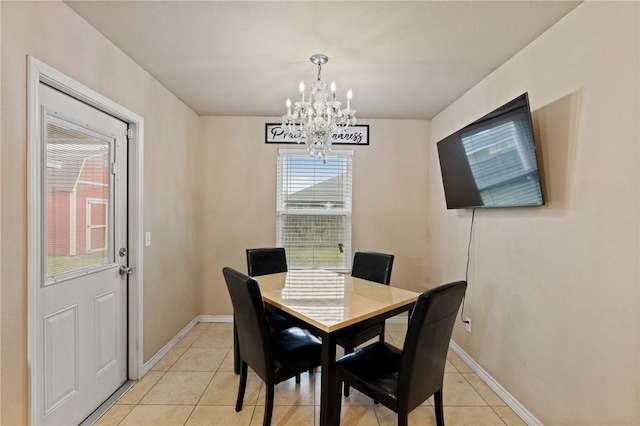 tiled dining area with an inviting chandelier