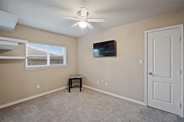 unfurnished bedroom featuring light colored carpet and ceiling fan