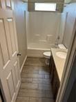 full bathroom featuring vanity, toilet, and shower / tub combination