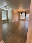 unfurnished room with hardwood / wood-style floors