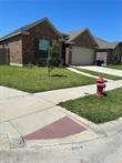 view of front facade with a front lawn and a garage