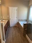 bathroom featuring hardwood / wood-style flooring