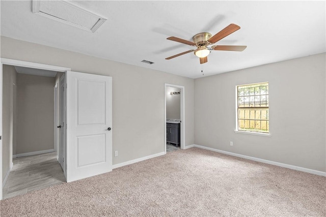 5611 Nelson, Corpus Christi, TX 78411 - unfurnished bedroom featuring light colored carpet, attic access, ensuite bathroom, and a ceiling fan