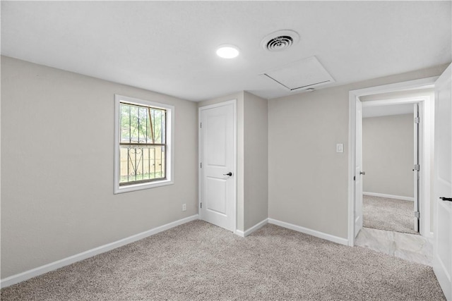 5611 Nelson, Corpus Christi, TX 78411 - unfurnished bedroom featuring attic access and light colored carpet