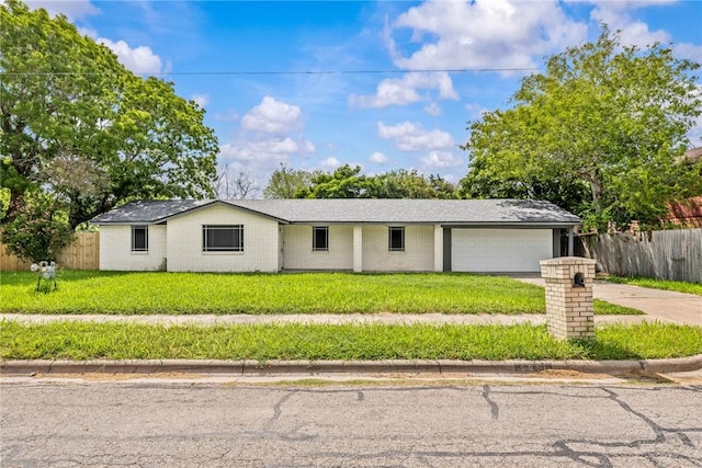 5611 Nelson, Corpus Christi, TX 78411 - view of front of house with an attached garage and driveway
