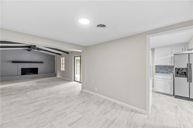 5611 Nelson, Corpus Christi, TX 78411 - unfurnished living room with ceiling fan and a fireplace