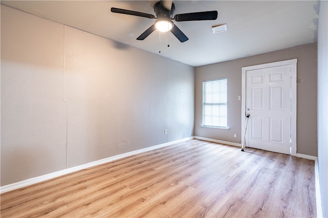 unfurnished room with light hardwood / wood-style flooring and ceiling fan