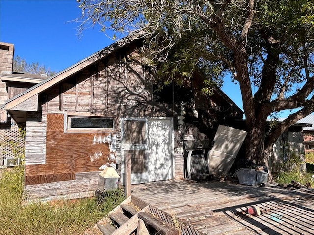 view of side of property with a deck