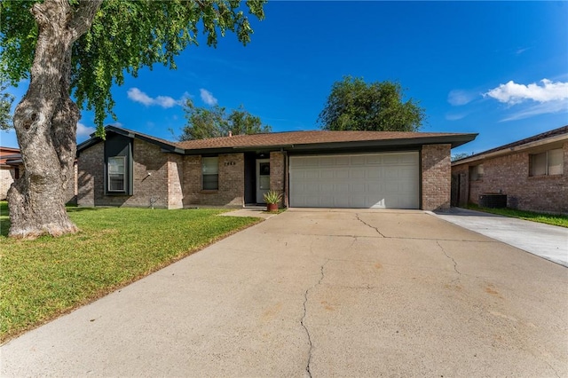 ranch-style home with a front yard and a garage