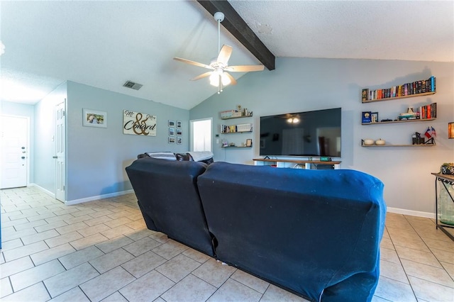 tiled living room with ceiling fan, a textured ceiling, and lofted ceiling with beams