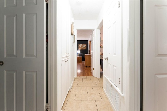 corridor with light tile patterned floors