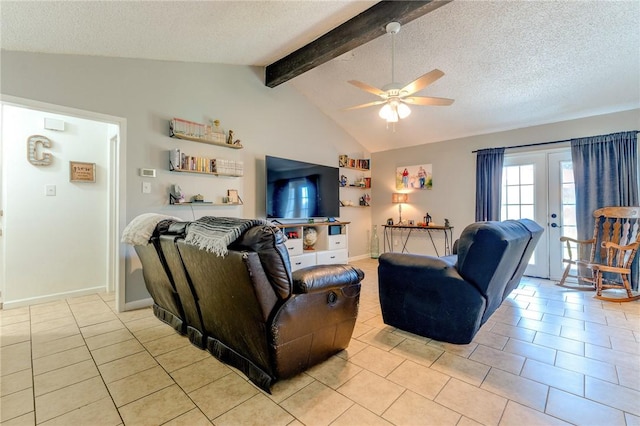 tiled living room with lofted ceiling with beams, a textured ceiling, ceiling fan, and french doors