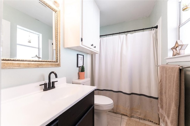 bathroom featuring tile patterned floors, toilet, and vanity