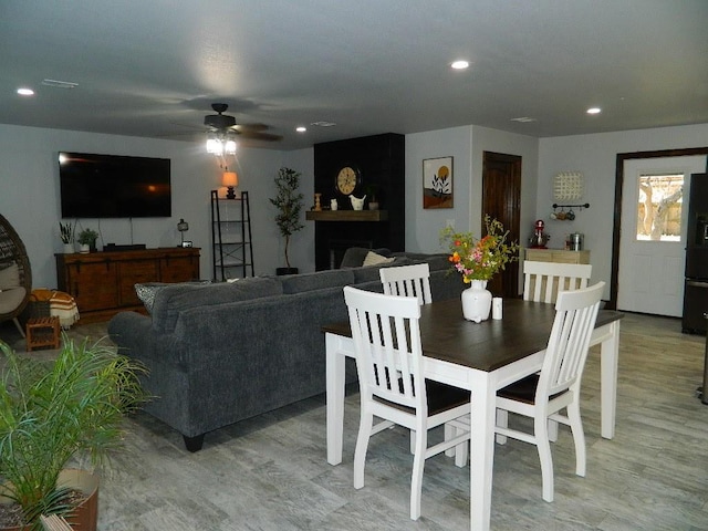 dining room featuring ceiling fan and light wood-type flooring