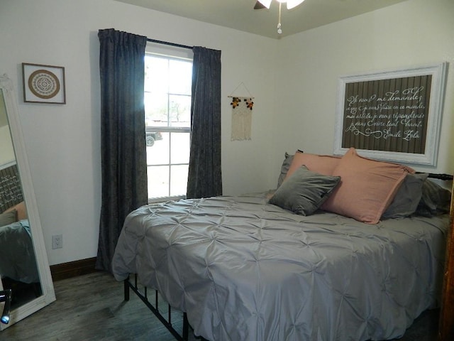 bedroom with dark wood-type flooring