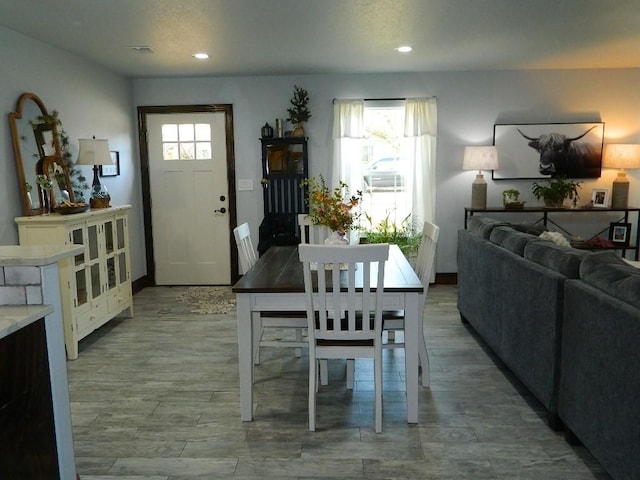 dining area with hardwood / wood-style flooring