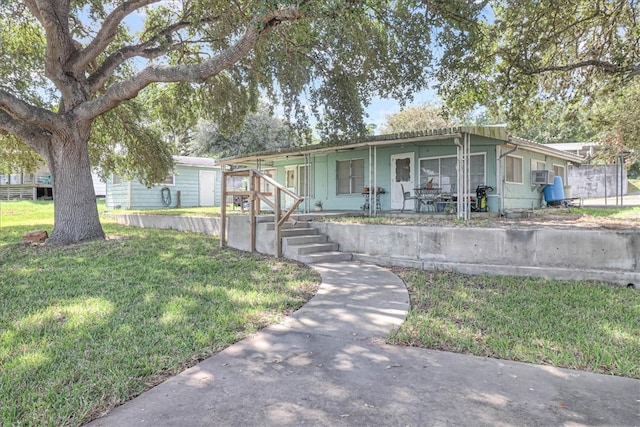 view of front of house featuring a front yard and covered porch