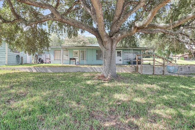 single story home with a front yard