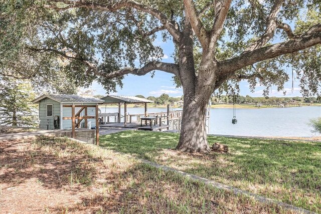 195 Carmel Dr, Sandia, TX 78383 - view of grassy yard with a water view and a dock