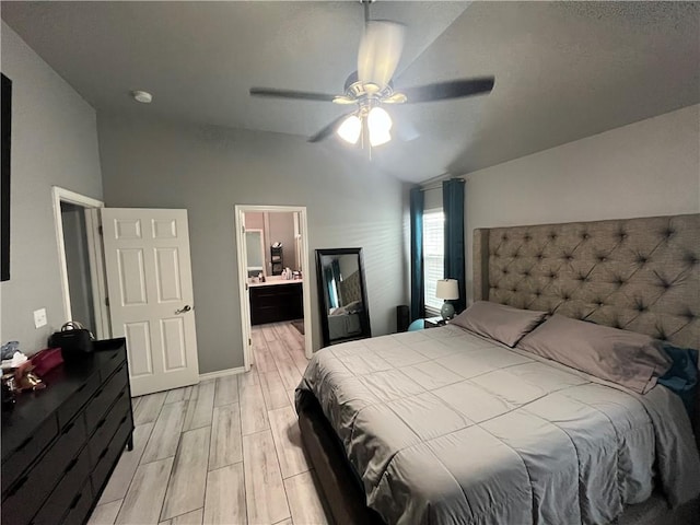7305 Russ, Corpus Christi, TX 78414 - bedroom with vaulted ceiling, wood tiled floors, ceiling fan, and ensuite bath