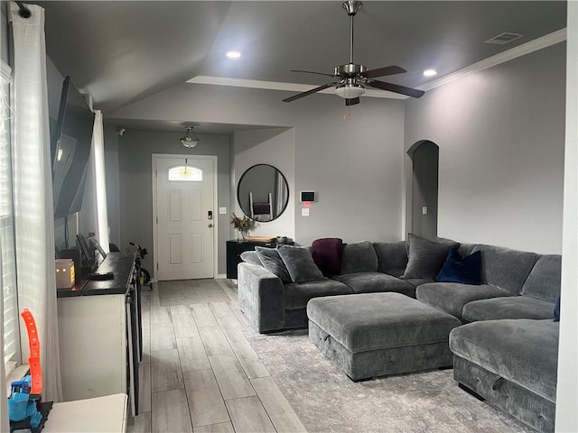 7305 Russ, Corpus Christi, TX 78414 - living room featuring ceiling fan, arched walkways, light wood-style flooring, crown molding, and vaulted ceiling