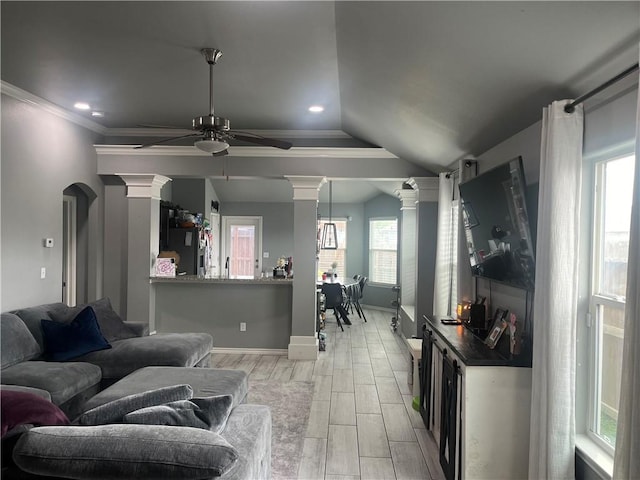 7305 Russ, Corpus Christi, TX 78414 - living room featuring decorative columns, a ceiling fan, wood tiled floors, ornamental molding, and lofted ceiling
