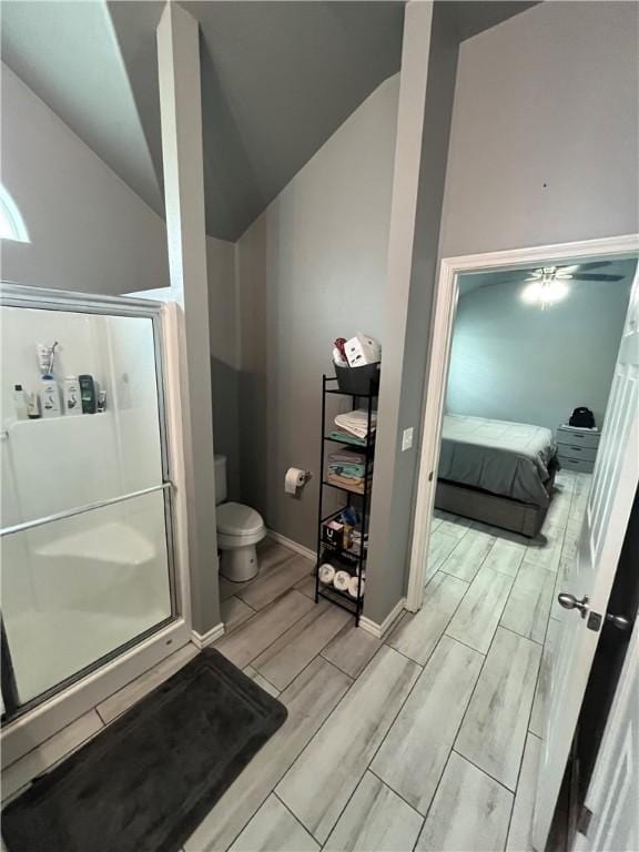 7305 Russ, Corpus Christi, TX 78414 - ensuite bathroom with lofted ceiling, wood tiled floors, and a shower stall
