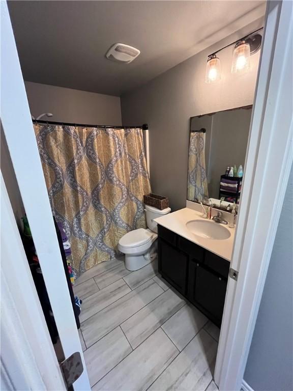 7305 Russ, Corpus Christi, TX 78414 - full bathroom with vanity and toilet
