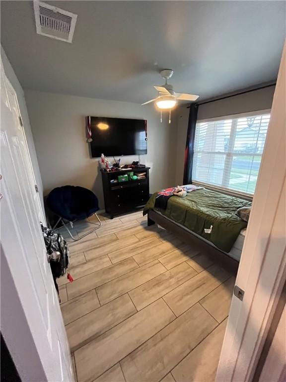 7305 Russ, Corpus Christi, TX 78414 - bedroom with wood tiled floors and ceiling fan