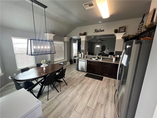 7305 Russ, Corpus Christi, TX 78414 - kitchen with stainless steel appliances, ornate columns, lofted ceiling, light wood-style floors, and a ceiling fan