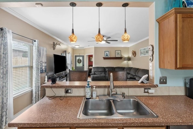 6517 Marblewing Dr, Corpus Christi, TX 78414 - kitchen featuring a sink, crown molding, dark countertops, open floor plan, and ceiling fan