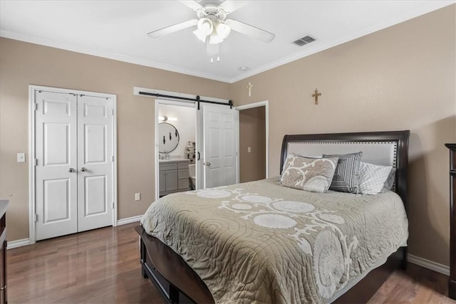 6517 Marblewing Dr, Corpus Christi, TX 78414 - bedroom featuring a barn door, wood finished floors, baseboards, crown molding, and a ceiling fan