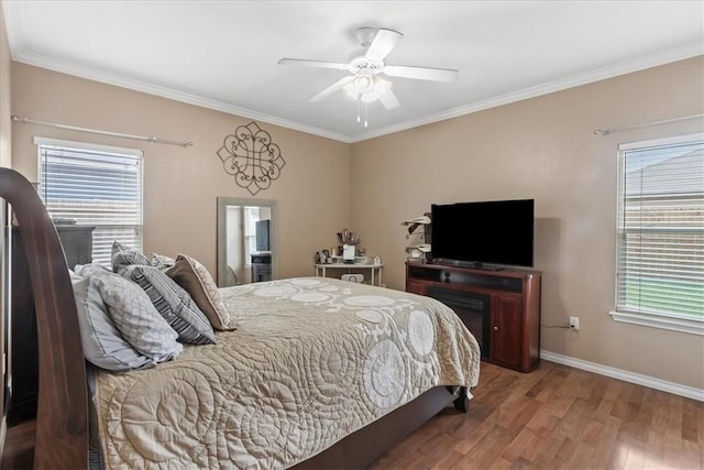6517 Marblewing Dr, Corpus Christi, TX 78414 - bedroom featuring wood finished floors, crown molding, baseboards, and ceiling fan