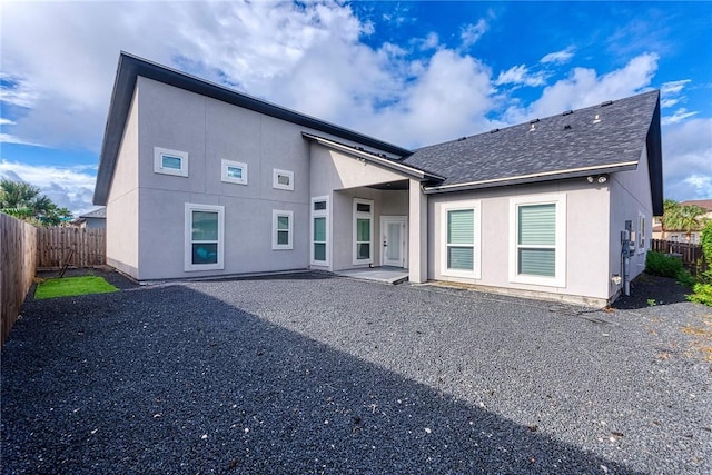 back of house with a patio