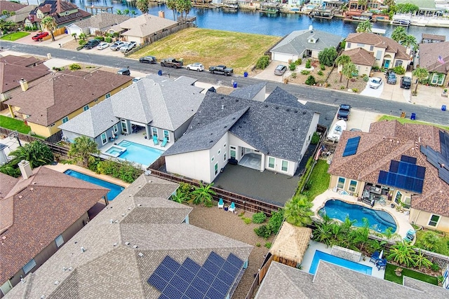 birds eye view of property with a water view