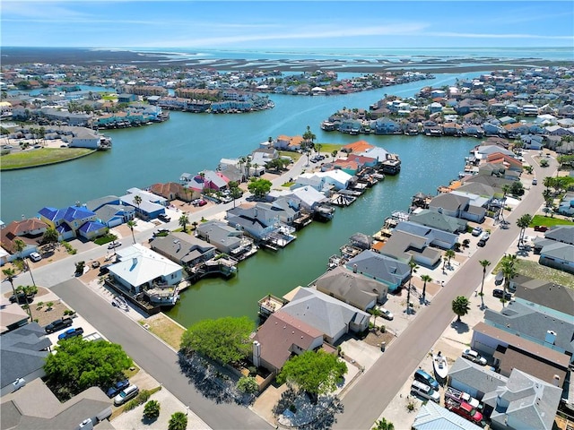 birds eye view of property with a water view and a residential view
