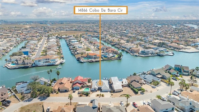 bird's eye view featuring a residential view and a water view