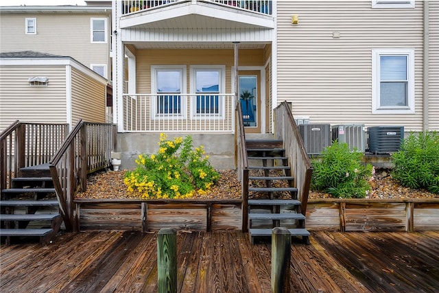 property entrance with central AC and a deck