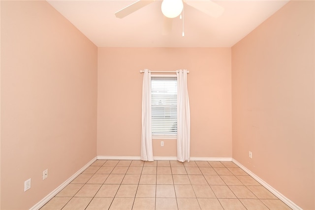 spare room featuring light tile patterned flooring and ceiling fan