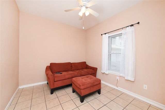 sitting room featuring ceiling fan and light tile patterned flooring